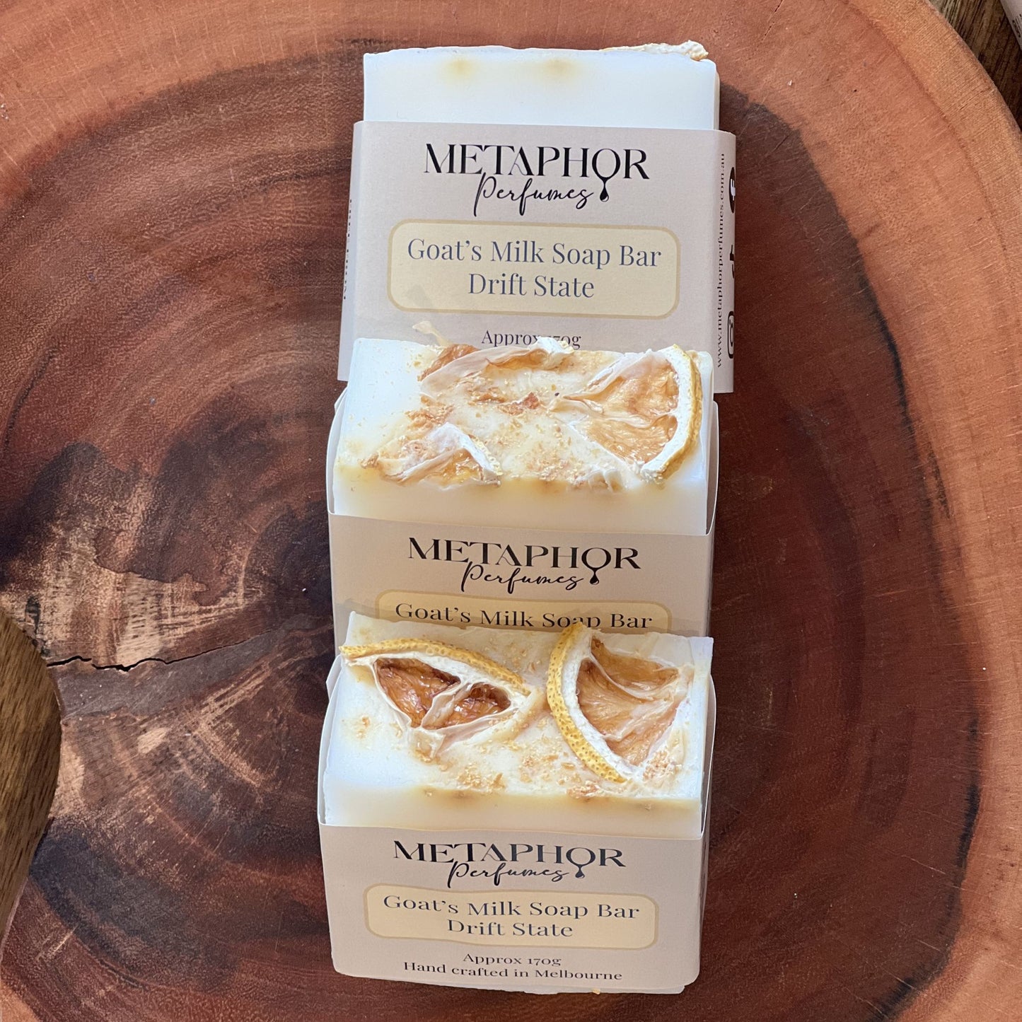Product image of Metaphor Perfumes goat’s milk soap bar on a wooden surface — Drift State, inspired by Louis Vuitton Afternoon Swim.