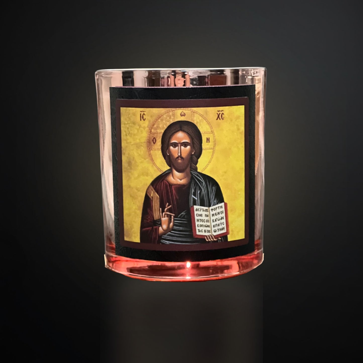 Rose‑Gold Livani candle with Christ icon, rose‑gold vessel and black framing on a dark gradient background.