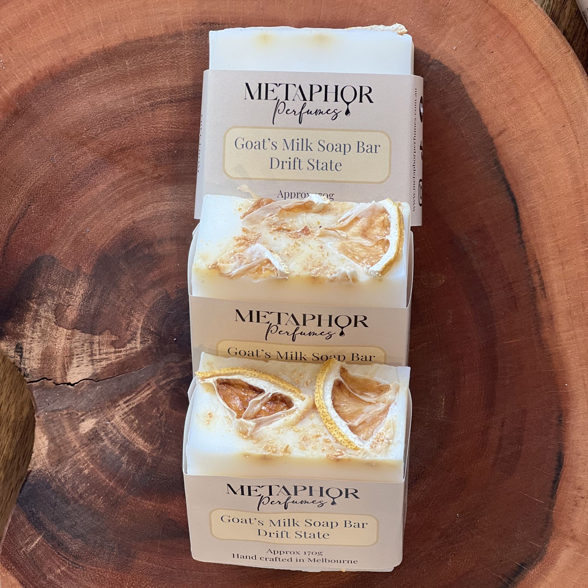 Product image of Metaphor Perfumes goat’s milk soap bar on a wooden surface — Drift State, inspired by Louis Vuitton Afternoon Swim.