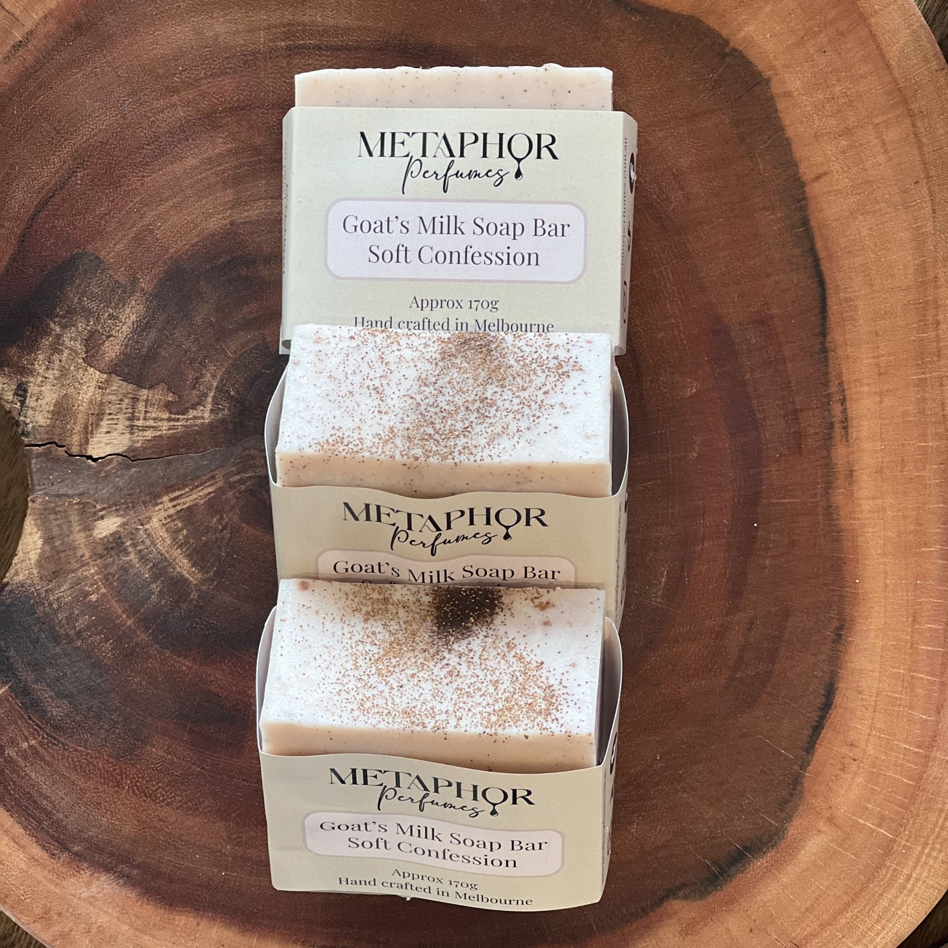 Product image of Metaphor Perfumes goat’s milk soap bar on a wooden surface — Soft Confession, inspired by Kilian Love Don’t Be Shy.