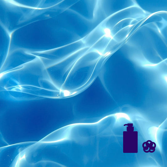 Blue, water‑like surface with wave reflections and body‑wash and loofah icons in the corner.