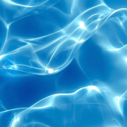 “Sunlit blue water with bright, shimmering reflections and soft wave patterns, capturing the refreshing aquatic energy of Drift State by Metaphor.”